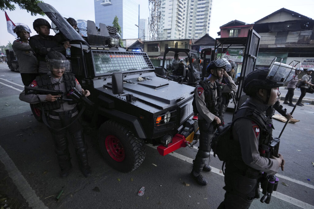 Police and protesters clash during Indonesia political demonstrations
